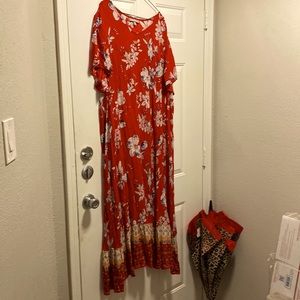 Red floral flowing dress, light smooth. It flows when you walk and comfortable.